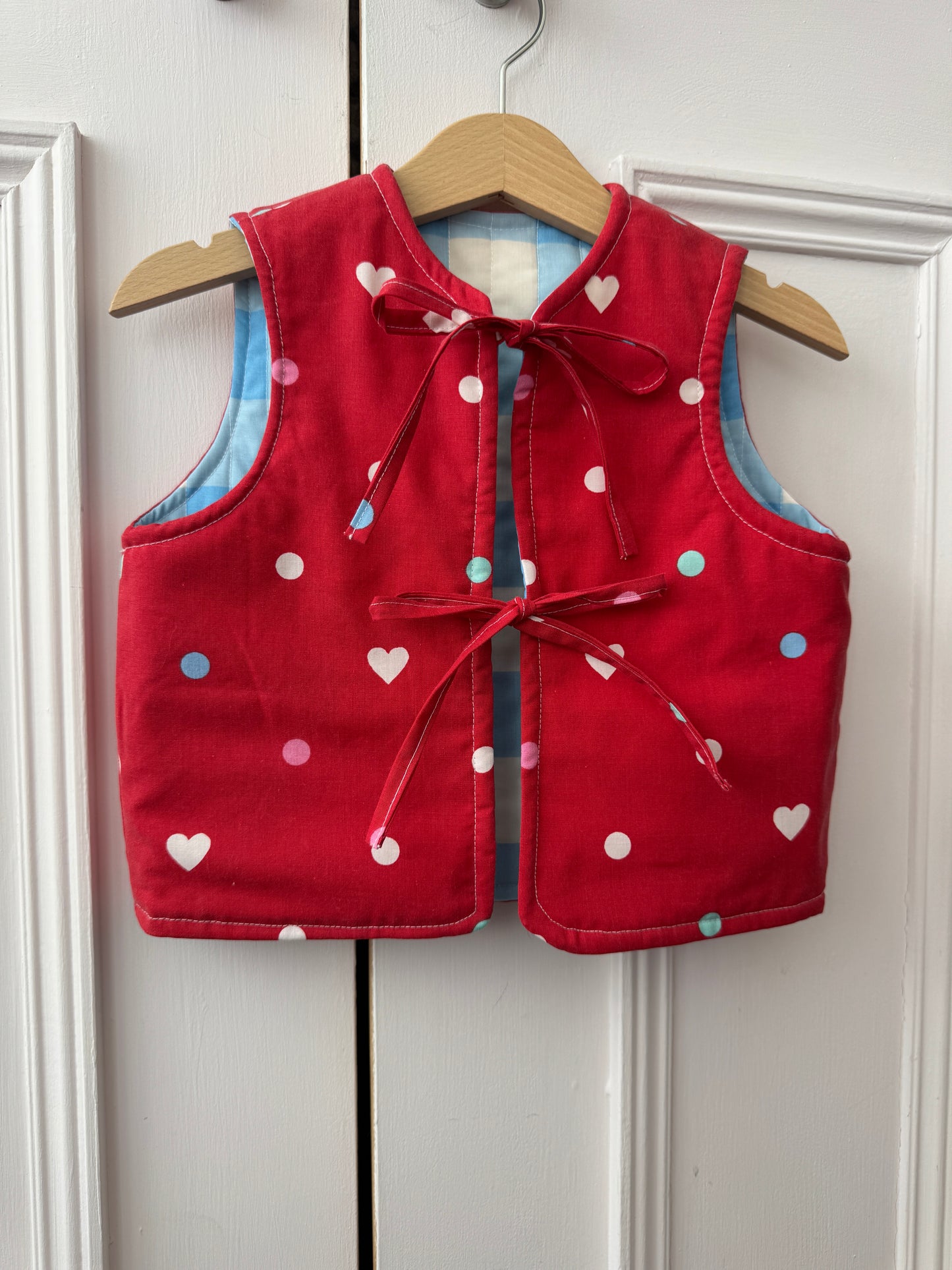 Blue gingham/hearts reversible quilted gilet 1-2 years