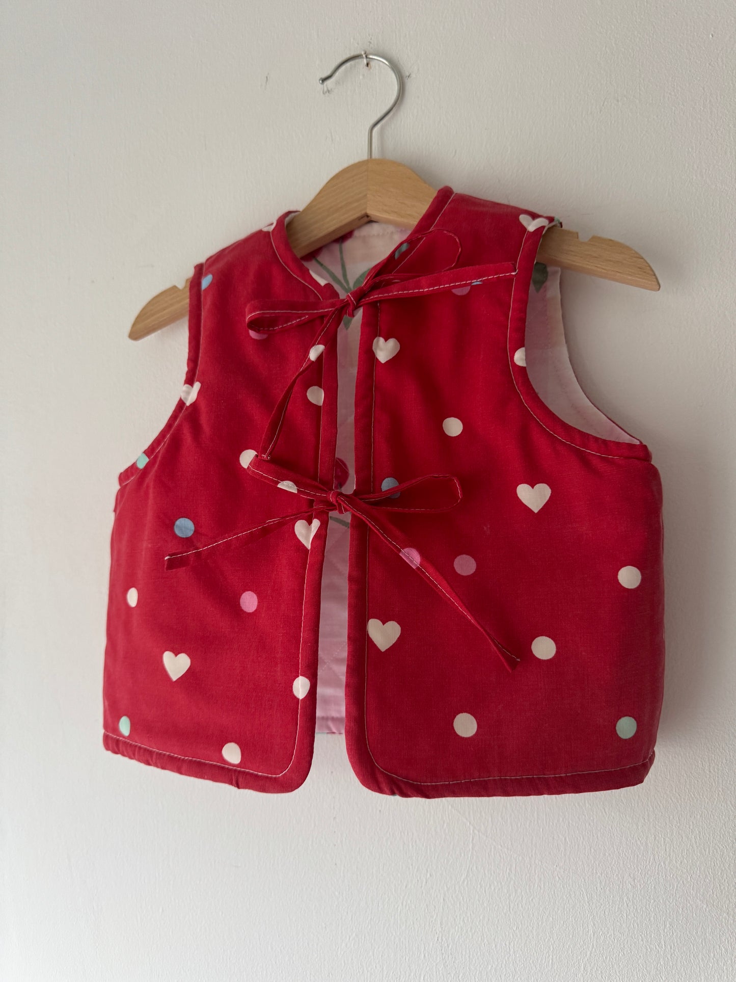 Cherry/hearts reversible quilted gilet 1-2 years