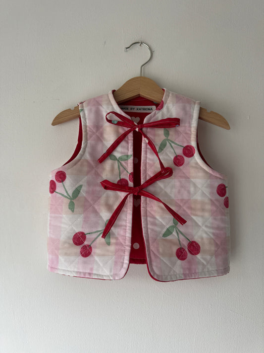 Cherry/hearts reversible quilted gilet 1-2 years