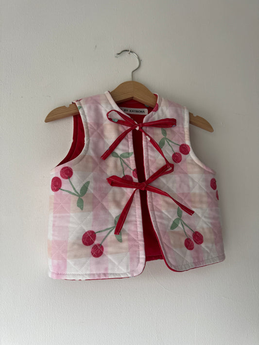 Cherry/hearts reversible quilted gilet 1-2 years