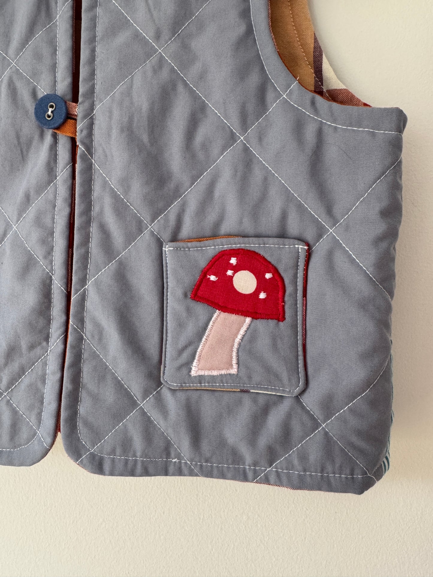Hedgehog & toadstool reversible quilted gilet 1-2 years
