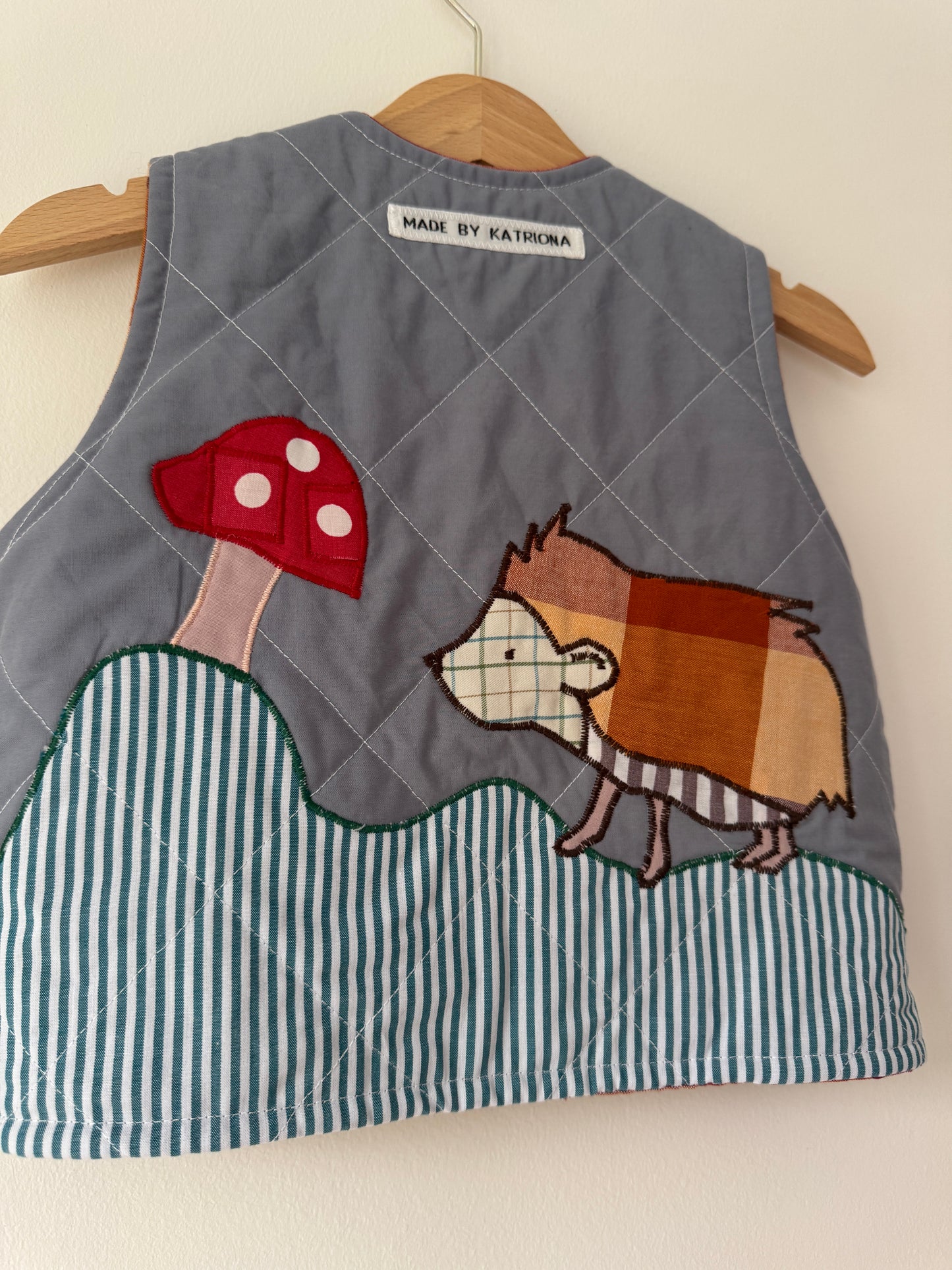 Hedgehog & toadstool reversible quilted gilet 1-2 years